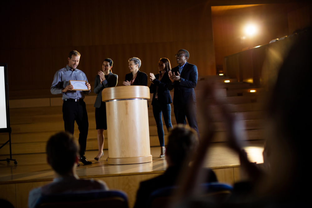Event emcee interacting with guests on stage